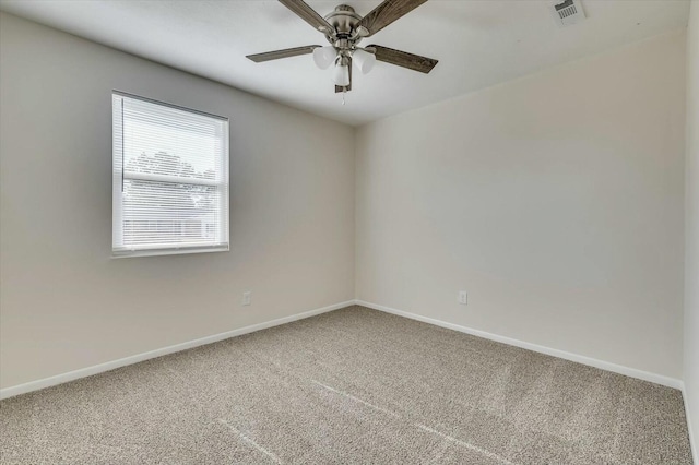 spare room with carpet flooring and ceiling fan