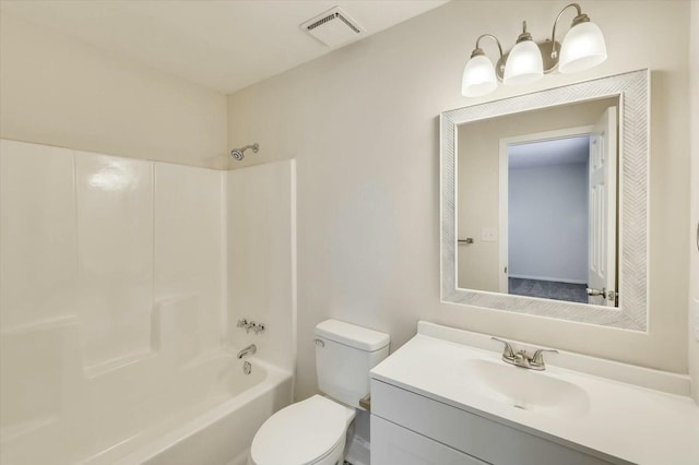 full bathroom featuring washtub / shower combination, vanity, and toilet