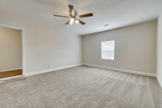 carpeted empty room with ceiling fan