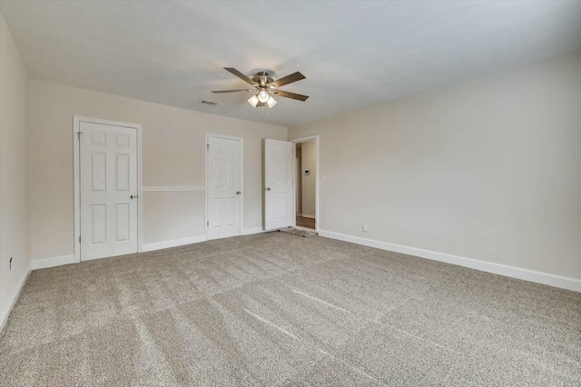 unfurnished room with ceiling fan and carpet floors