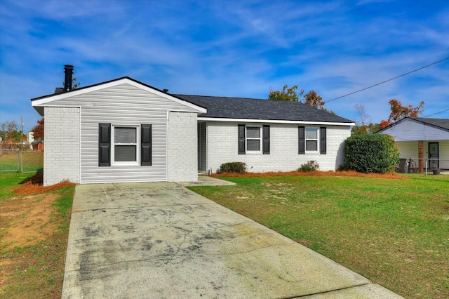 ranch-style house with a front lawn