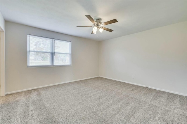 empty room featuring carpet floors and ceiling fan