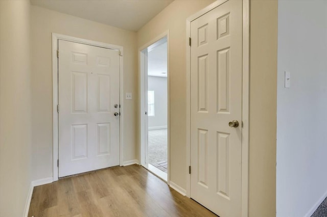 hallway featuring light wood-type flooring