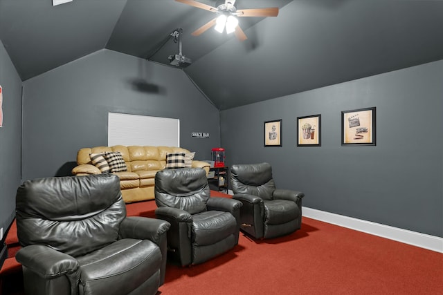 carpeted home theater featuring ceiling fan, baseboards, and vaulted ceiling