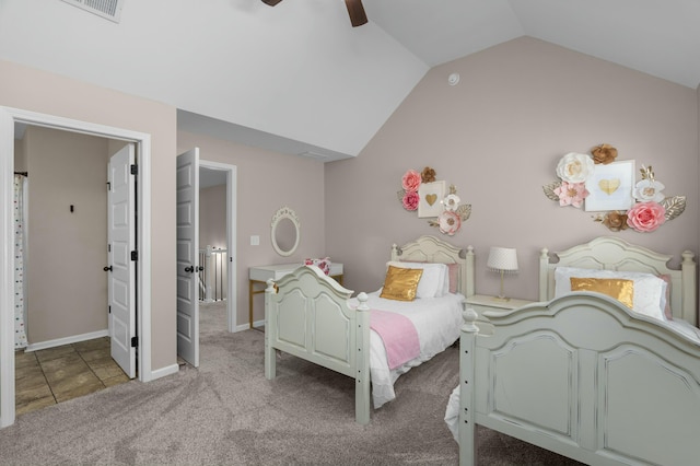 carpeted bedroom featuring baseboards, visible vents, vaulted ceiling, and a ceiling fan