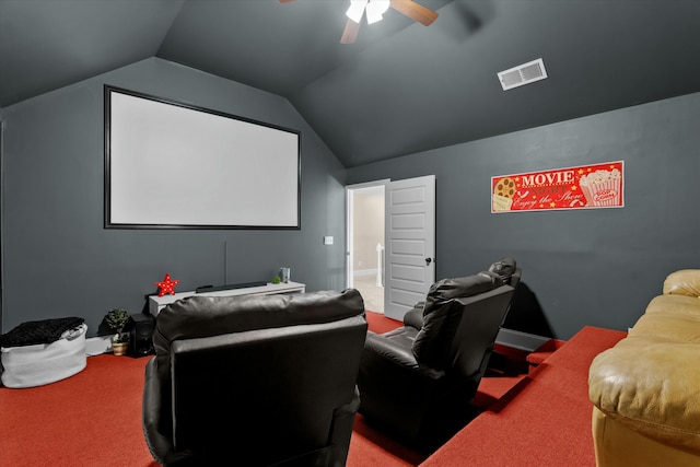 home theater room with a ceiling fan, lofted ceiling, visible vents, and carpet