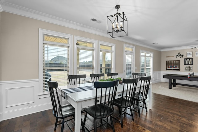 dining room with visible vents, dark wood-type flooring, a wealth of natural light, and crown molding