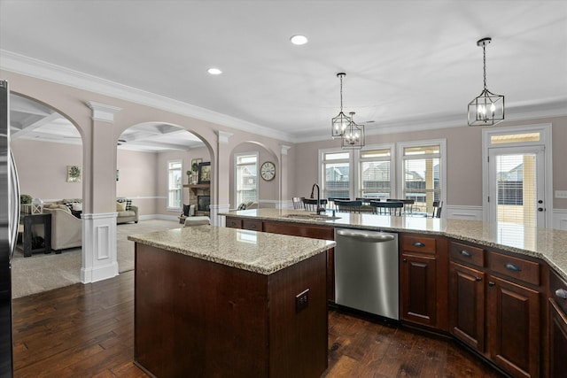 kitchen with decorative columns, dishwasher, dark wood-type flooring, a center island, and a sink