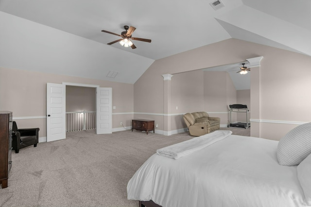 carpeted bedroom with baseboards, visible vents, and vaulted ceiling