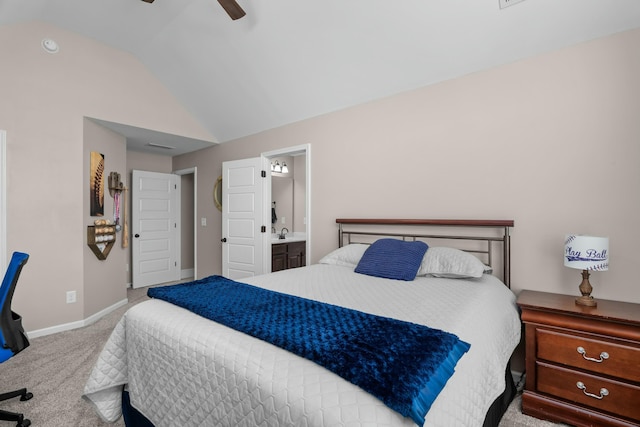 bedroom featuring lofted ceiling, connected bathroom, carpet floors, a ceiling fan, and baseboards