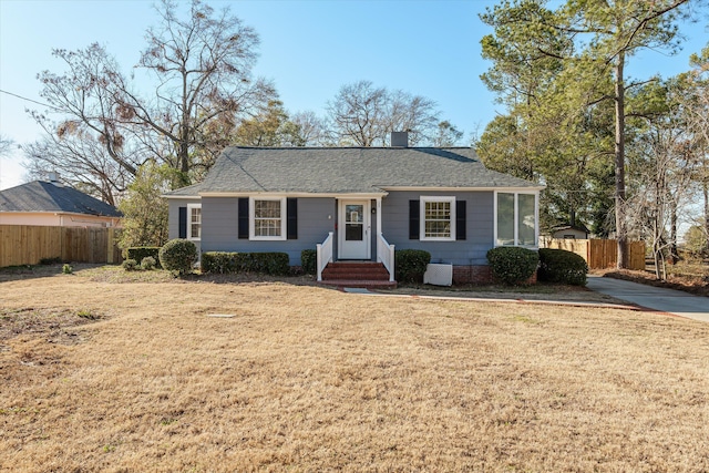 single story home with a front lawn