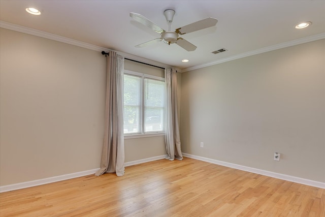 spare room featuring ornamental molding, light wood-style floors, baseboards, a ceiling fan, and recessed lighting