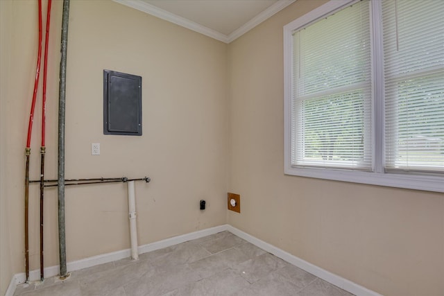 clothes washing area featuring electric panel, crown molding, hookup for an electric dryer, and baseboards