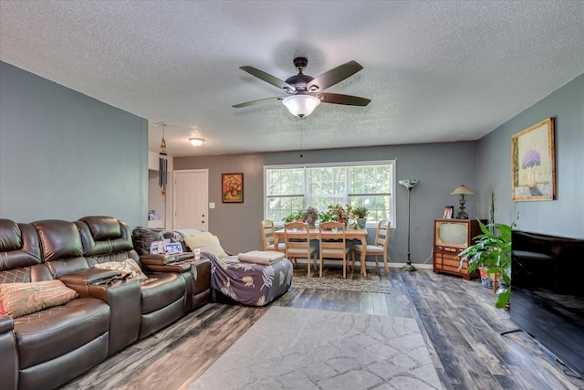 2382 Patrick Ave, Hephzibah, GA 30815 - living area featuring wood finished floors, a textured ceiling, and a ceiling fan