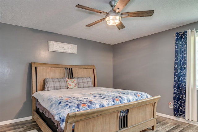 2382 Patrick Ave, Hephzibah, GA 30815 - bedroom featuring wood finished floors, baseboards, ceiling fan, and a textured ceiling