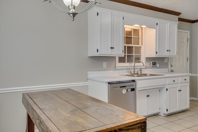 kitchen with stainless steel dishwasher, light tile patterned floors, white cabinetry, and a sink