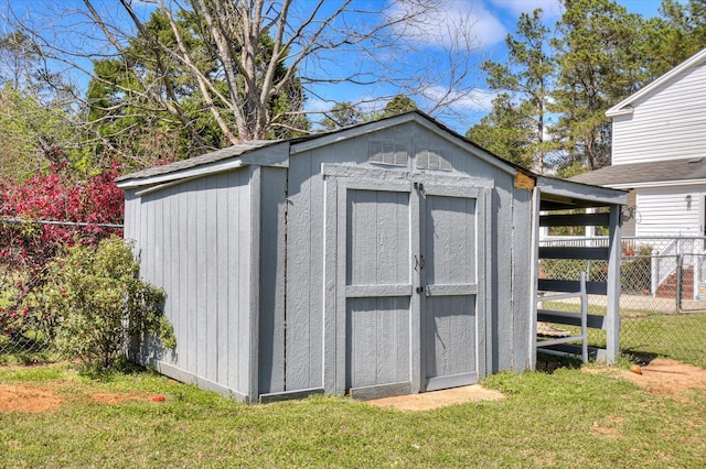 view of shed with fence