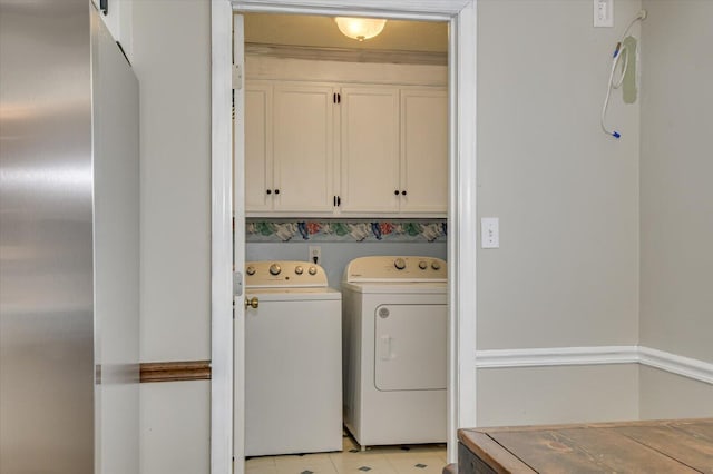 laundry area featuring cabinet space and washing machine and dryer