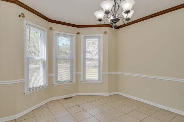 empty room with a chandelier, visible vents, baseboards, and ornamental molding