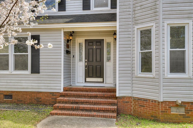doorway to property with crawl space and roof with shingles