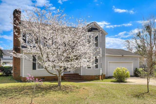 view of front of property featuring a front yard, a chimney, a garage, crawl space, and driveway