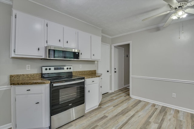 216 Dry Creek Rd, Evans, GA 30809 - kitchen featuring stainless steel appliances, white cabinets, dark countertops, light wood-type flooring, and ornamental molding