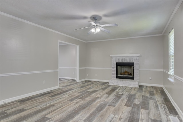 216 Dry Creek Rd, Evans, GA 30809 - unfurnished living room with ceiling fan, wood finished floors, a brick fireplace, baseboards, and crown molding