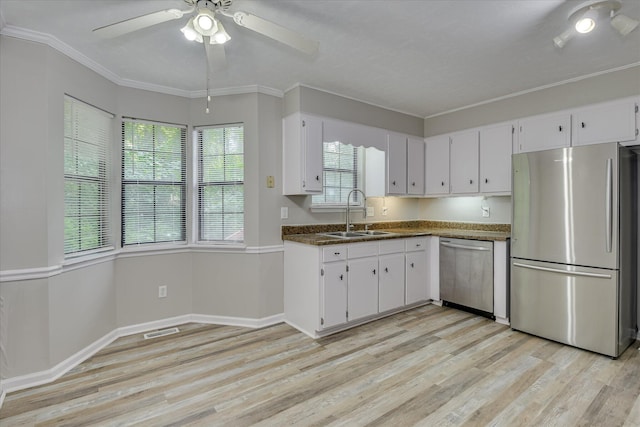 216 Dry Creek Rd, Evans, GA 30809 - kitchen featuring stainless steel appliances, a sink, a ceiling fan, light wood-style floors, and white cabinetry