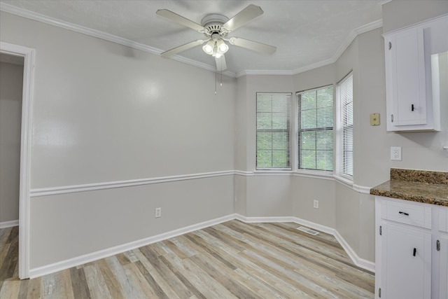 216 Dry Creek Rd, Evans, GA 30809 - unfurnished dining area featuring light wood finished floors, a ceiling fan, baseboards, and crown molding