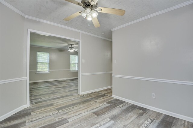 216 Dry Creek Rd, Evans, GA 30809 - spare room featuring ceiling fan, wood finished floors, baseboards, and crown molding