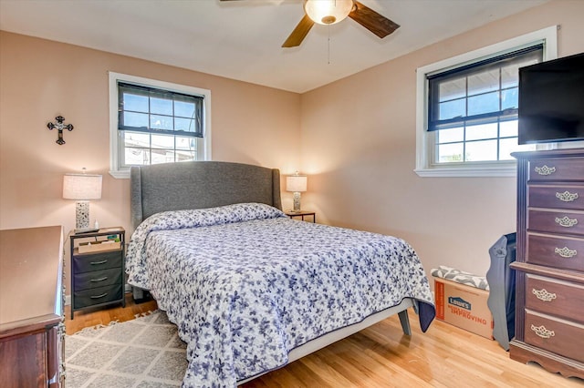 bedroom with ceiling fan and hardwood / wood-style floors