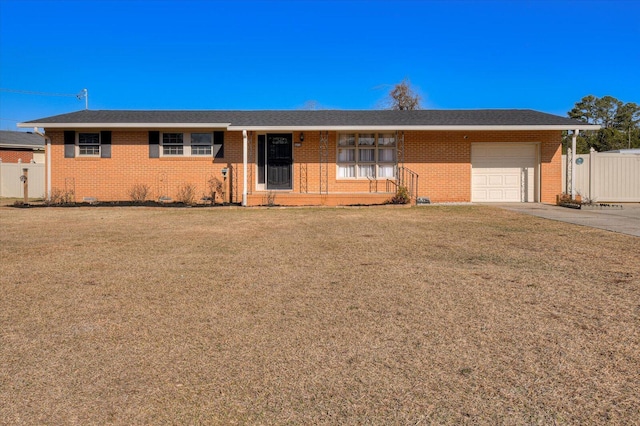 single story home with a garage and a front lawn