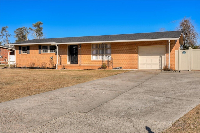 single story home with a front yard and a garage