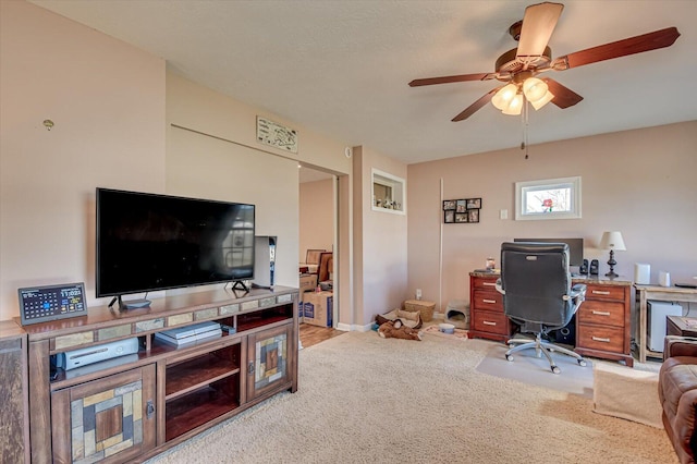 carpeted home office with ceiling fan