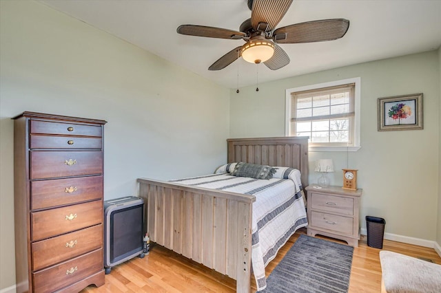 bedroom with ceiling fan and light hardwood / wood-style flooring