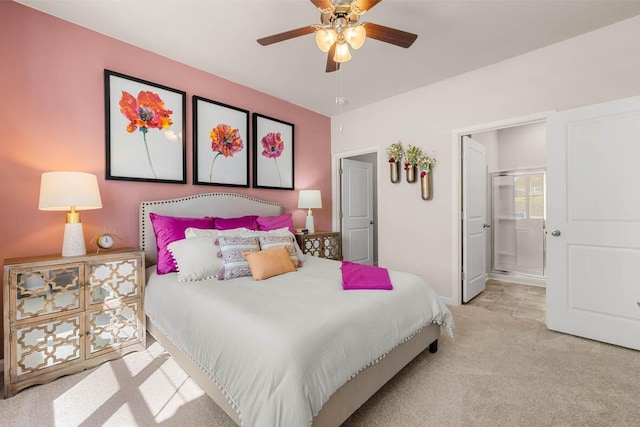 bedroom with ensuite bath, ceiling fan, and light carpet