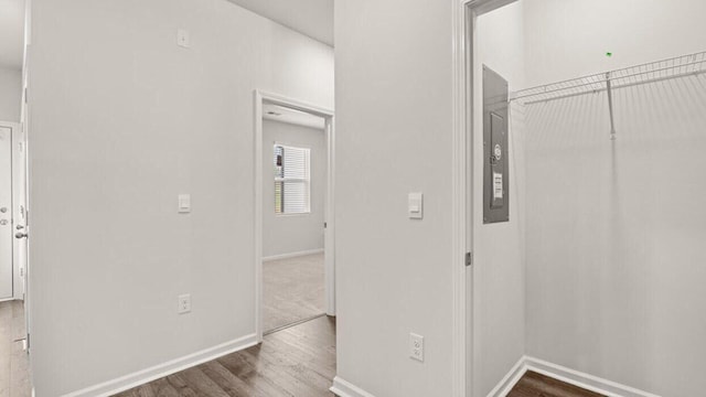 hallway with wood-type flooring