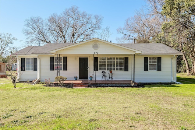 ranch-style house featuring a porch and a front lawn