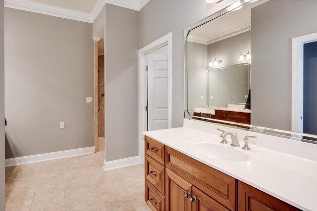 bathroom with tile patterned flooring, vanity, and crown molding