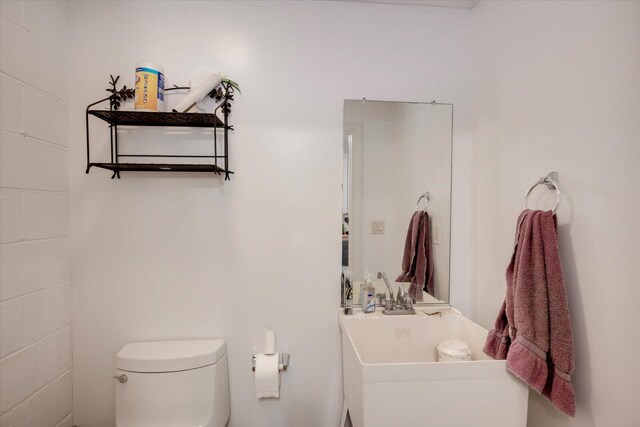 bathroom with toilet and sink