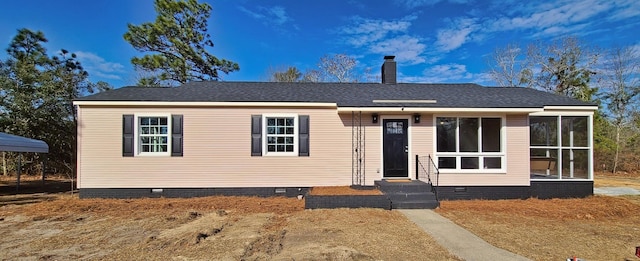 view of front of property featuring a sunroom