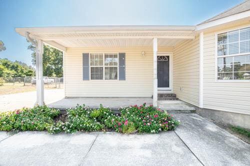 doorway to property with a porch