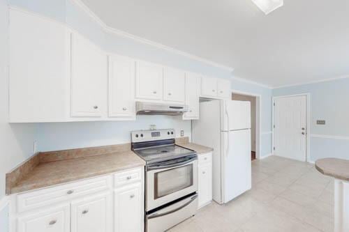 kitchen with stainless steel range with electric stovetop, white refrigerator, white cabinets, and crown molding