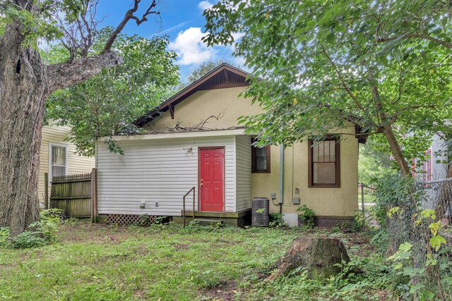 rear view of property with central air condition unit