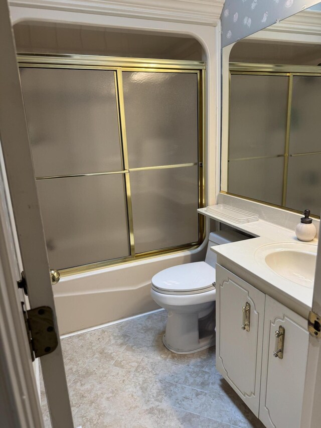 full bath featuring bath / shower combo with glass door, vanity, and toilet