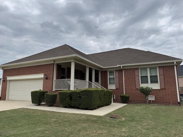 ranch-style home featuring a front yard, roof with shingles, brick siding, concrete driveway, and an attached garage