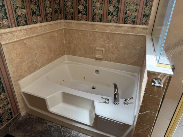 full bathroom with a jetted tub, a wainscoted wall, and wallpapered walls