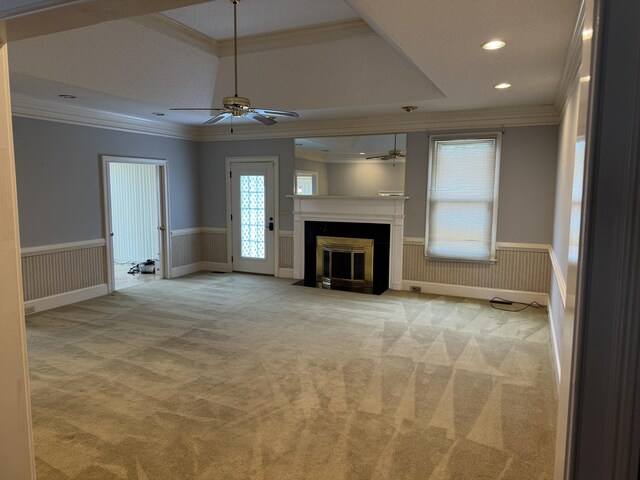 unfurnished living room featuring crown molding and ceiling fan