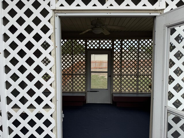 exterior space featuring a ceiling fan