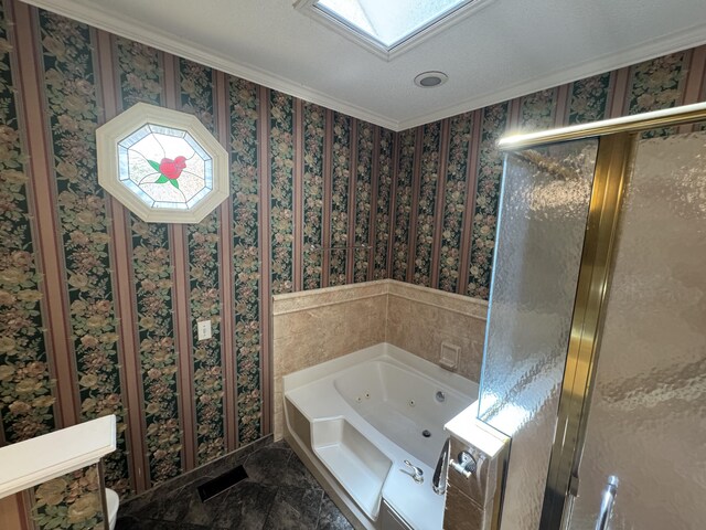 bathroom with crown molding, a whirlpool tub, wallpapered walls, and a skylight